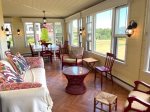 Comfortable seating in sunporch, view to Wood Island & lighthouse